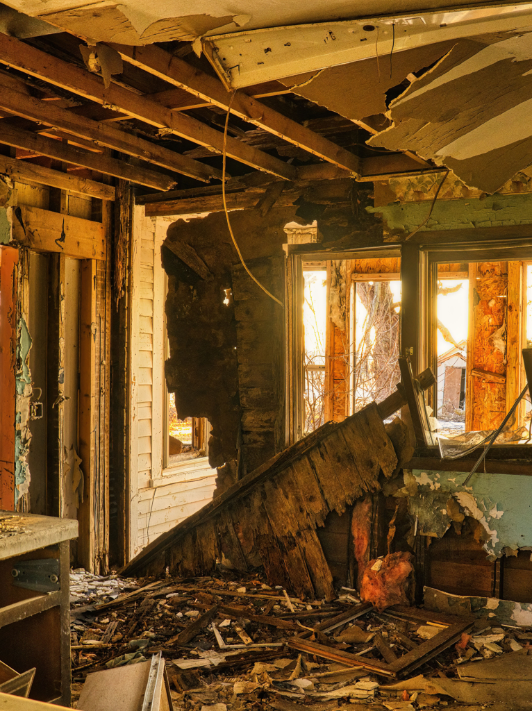 Interior of a severely damaged and dilapidated house.